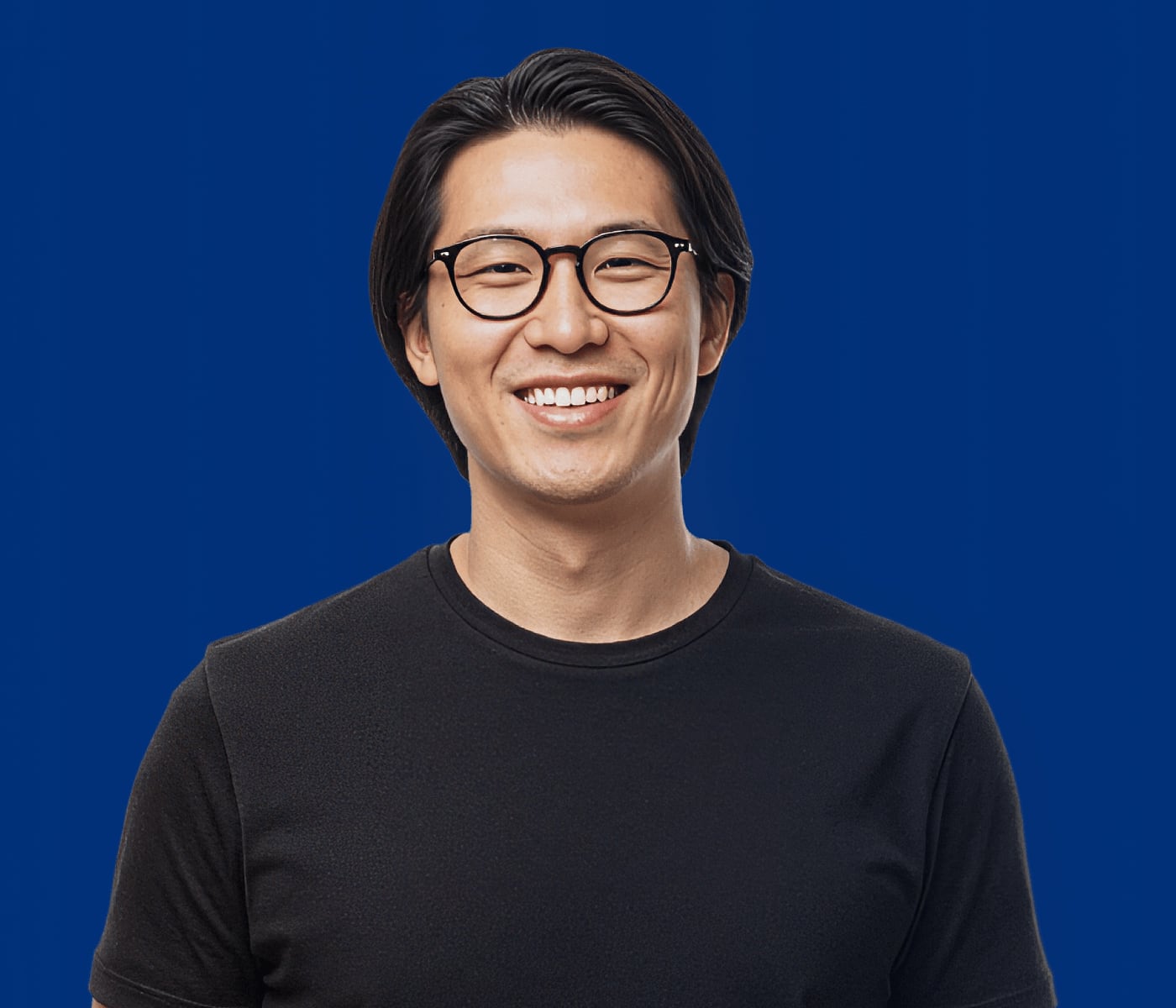An Ateko expert smiling and ready to answer your AI questions.