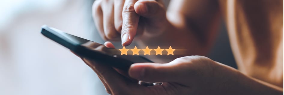 A customer giving a business a five-star rating for customer experience.
