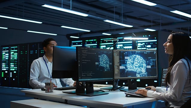 Technician inspecting server racks in a secure data centre