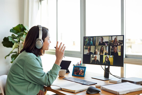 Employee using Webex from home to collaborate with colleagues online to maintain productivity and performance.